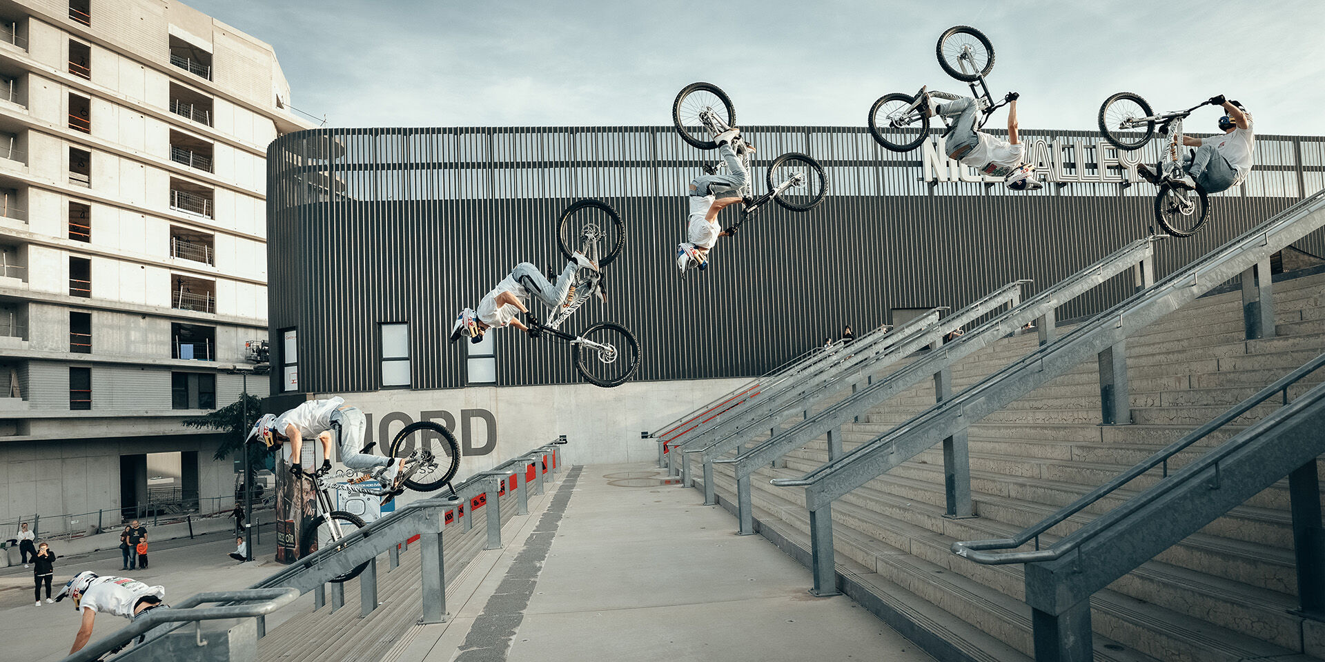 Fabio Wibmer backflipping the Canyon Torque “Guardian Angel” bike over a stair set.