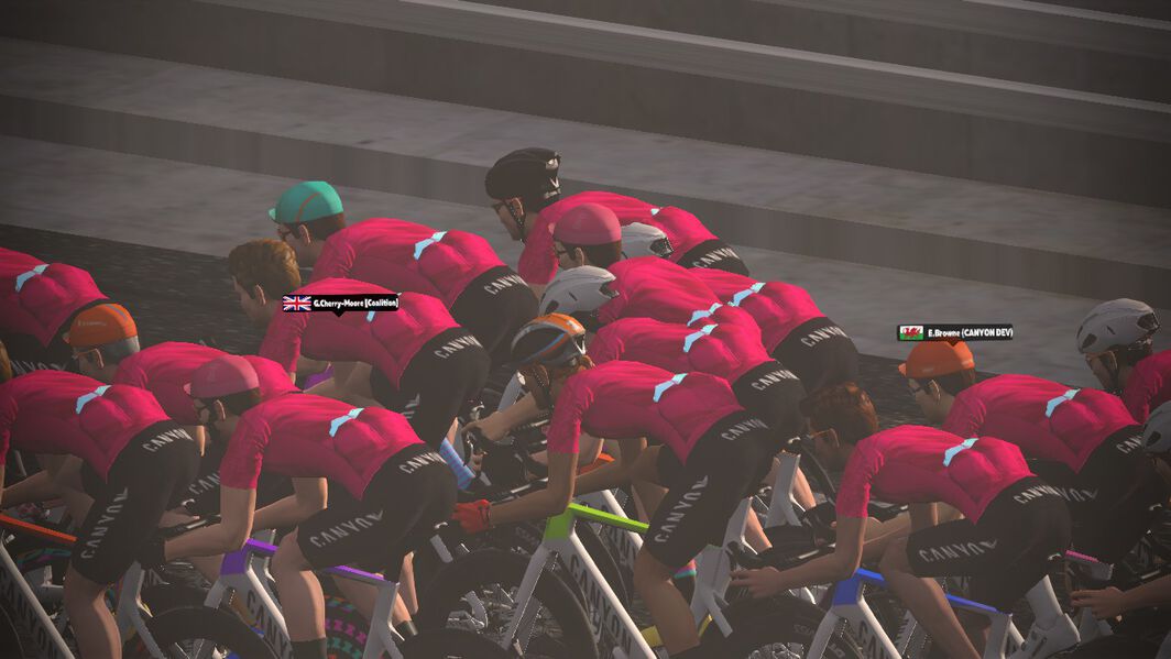 Avatars ride in a bunch together during a Zwift group ride.