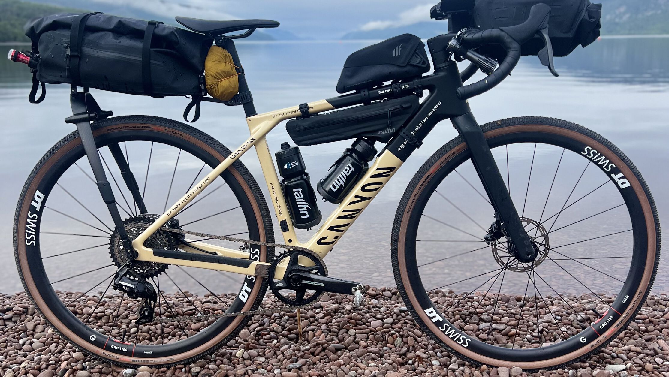 Canyon gravel bike with bikepacking setup&mdash;fully equipped with saddle, frame, and handlebar bags for extended off-road adventures.