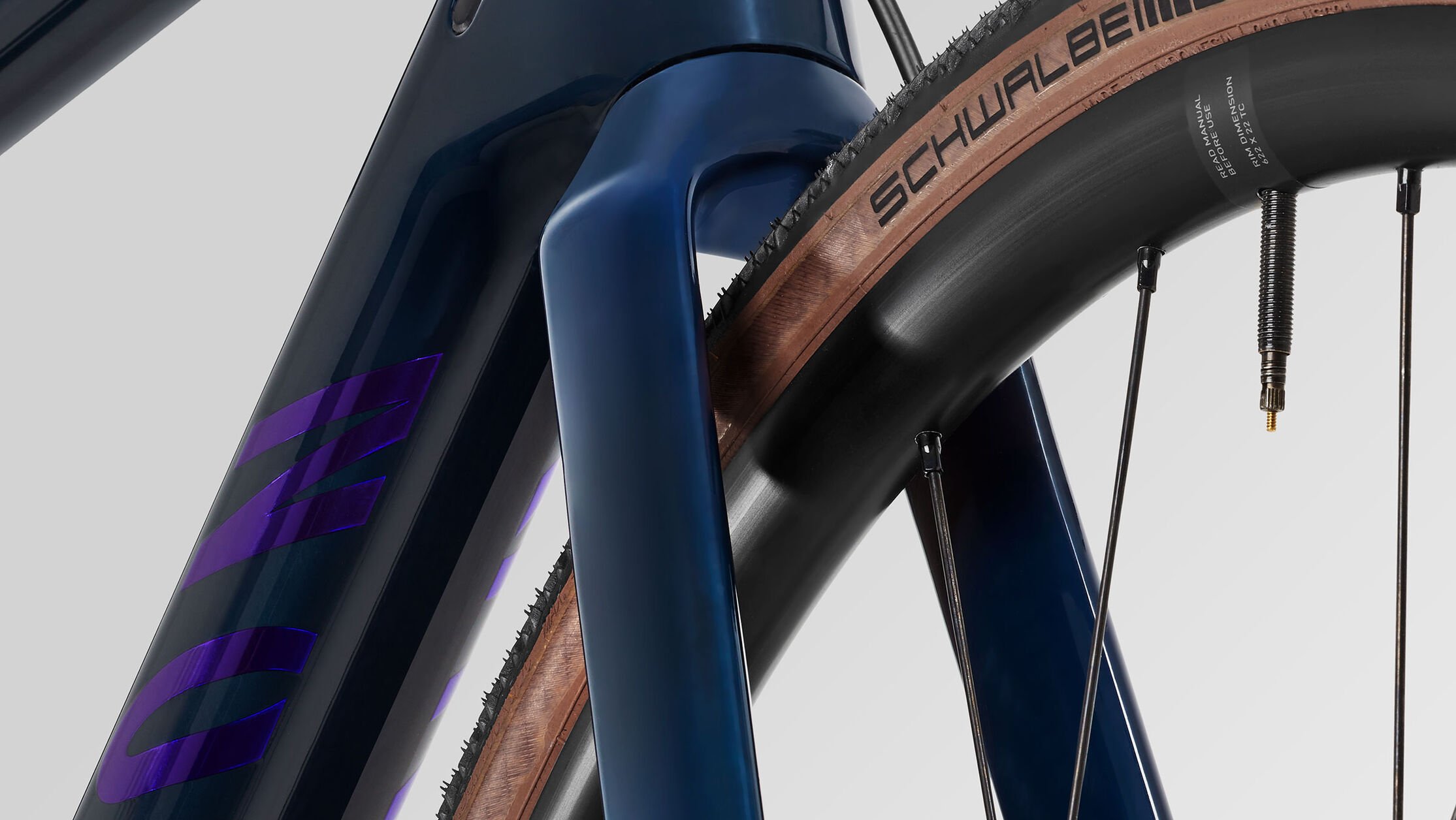 Close-up of Canyon all-road bike fork and tire showing high-performance carbon and aluminium frame materials